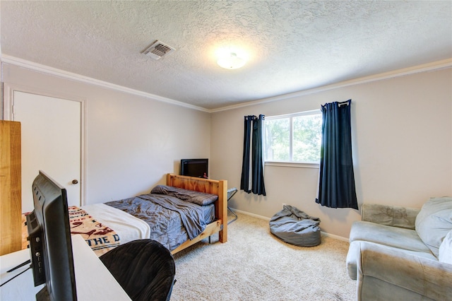 1223 Green Briar Dr, Huntsville, TX 77340 - carpeted bedroom featuring ornamental molding, a textured ceiling, and baseboards