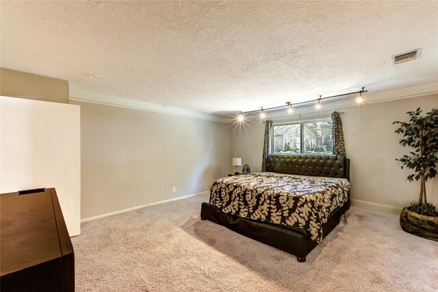 1223 Green Briar Dr, Huntsville, TX 77340 - bedroom featuring a textured ceiling, carpet, and baseboards