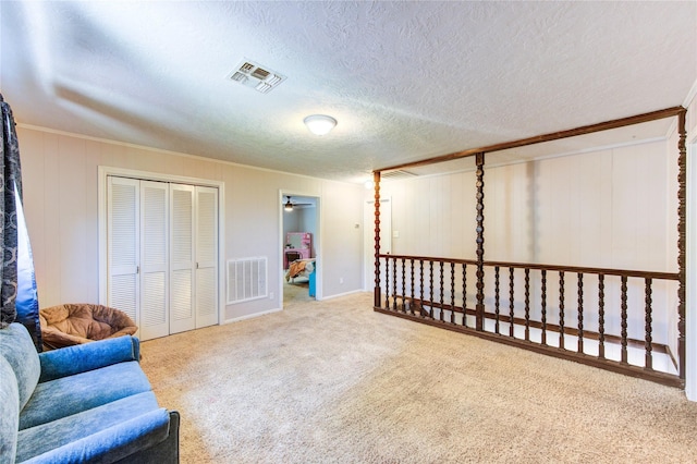1223 Green Briar Dr, Huntsville, TX 77340 - sitting room featuring carpet flooring, a textured ceiling, and baseboards