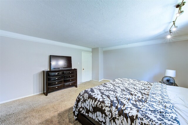 1223 Green Briar Dr, Huntsville, TX 77340 - bedroom featuring carpet, a textured ceiling, ornamental molding, and baseboards