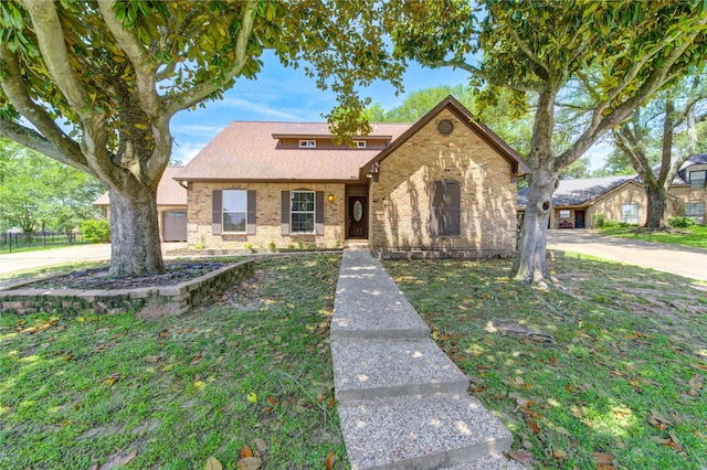 1223 Green Briar Dr, Huntsville, TX 77340 - view of front of property featuring brick siding and roof with shingles