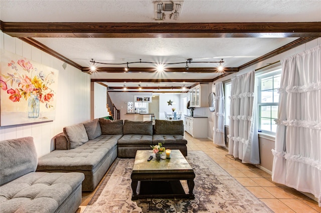 1223 Green Briar Dr, Huntsville, TX 77340 - living area featuring ornamental molding, light tile patterned floors, beamed ceiling, a textured ceiling, and stairs