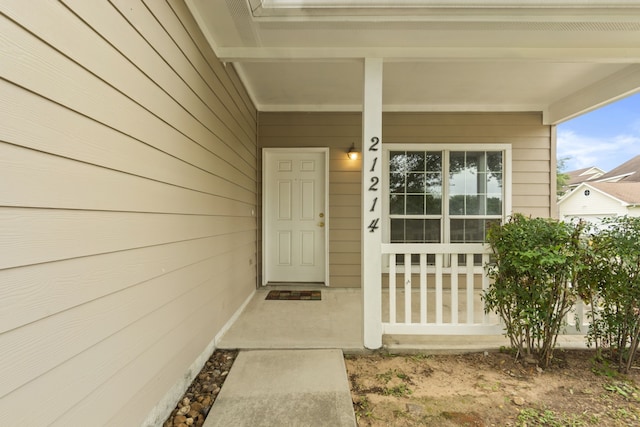 21214 Peachvine Ln, Tomball, TX 77375 - view of exterior entry with a porch