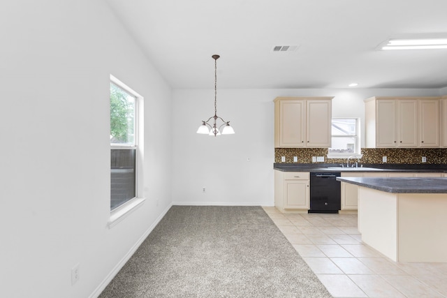 21214 Peachvine Ln, Tomball, TX 77375 - kitchen with dishwasher, cream cabinets, dark countertops, a chandelier, and plenty of natural light