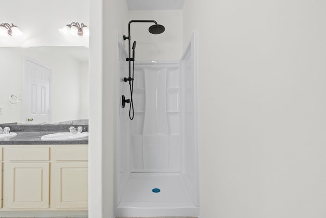 21214 Peachvine Ln, Tomball, TX 77375 - bathroom featuring a shower and double vanity