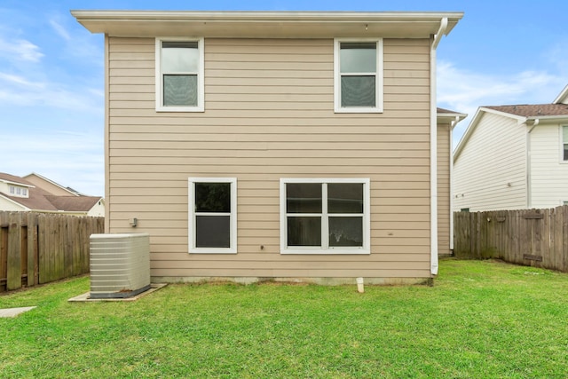 21214 Peachvine Ln, Tomball, TX 77375 - back of house featuring central AC unit