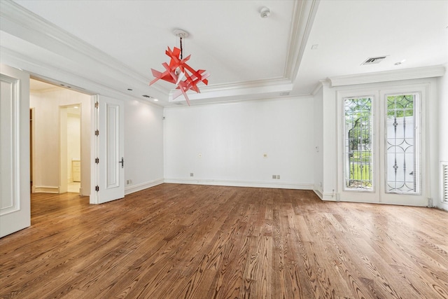 8618 Stable Crest Blvd, Houston, TX 77024 - unfurnished room featuring ornamental molding, a raised ceiling, wood finished floors, a smoke detector, and baseboards