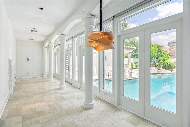 8618 Stable Crest Blvd, Houston, TX 77024 - doorway featuring decorative columns and baseboards