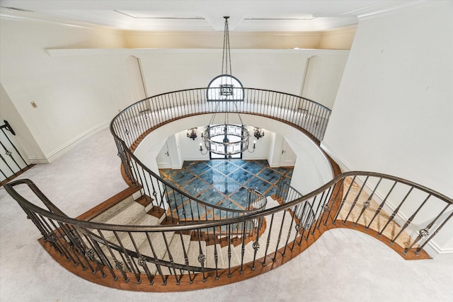 8618 Stable Crest Blvd, Houston, TX 77024 - staircase featuring a chandelier, carpet, ornamental molding, and baseboards