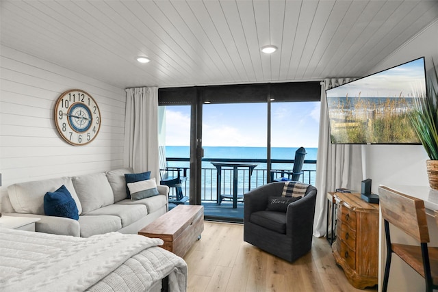 5220 Seawall Blvd Unit 1231, Galveston, TX 77551 - living area with expansive windows, plenty of natural light, light wood-type flooring, wooden ceiling, and recessed lighting
