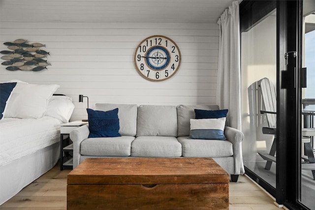 5220 Seawall Blvd Unit 1231, Galveston, TX 77551 - living room with wooden walls and light wood finished floors