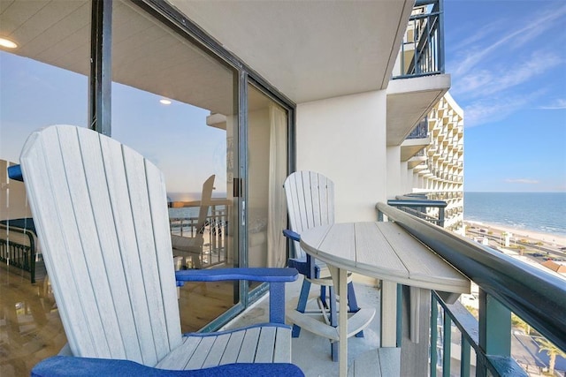 5220 Seawall Blvd Unit 1231, Galveston, TX 77551 - balcony featuring view of water and beach