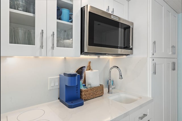 5220 Seawall Blvd Unit 1231, Galveston, TX 77551 - detailed view of stainless steel microwave and a sink