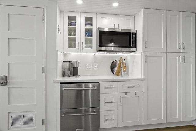 5220 Seawall Blvd Unit 1231, Galveston, TX 77551 - bar with stainless steel appliances and recessed lighting
