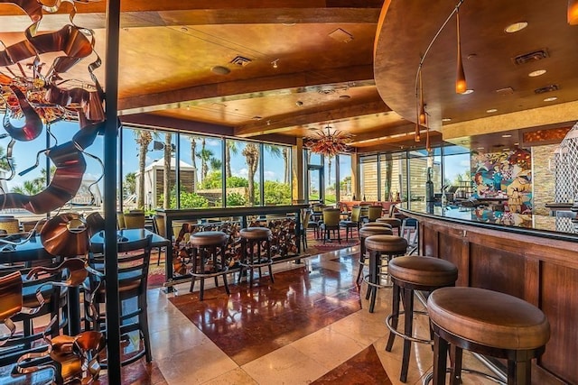 5220 Seawall Blvd Unit 1231, Galveston, TX 77551 - indoor dry bar with plenty of natural light and beamed ceiling