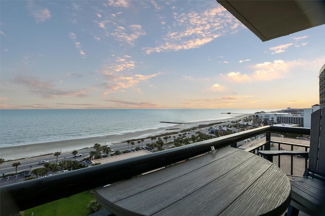 5220 Seawall Blvd Unit 1231, Galveston, TX 77551 - balcony at dusk with view of water and beach