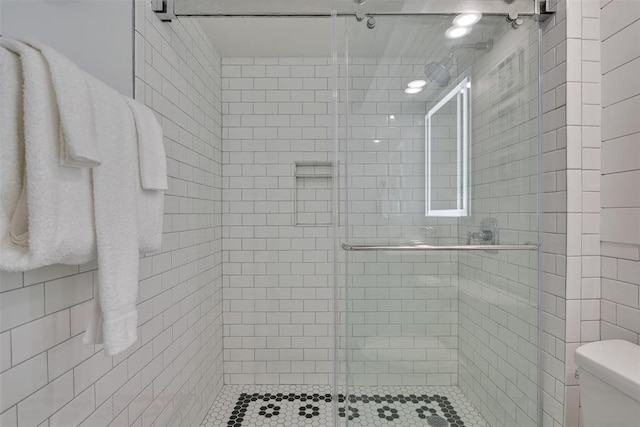 5220 Seawall Blvd Unit 1231, Galveston, TX 77551 - bathroom featuring toilet and a stall shower