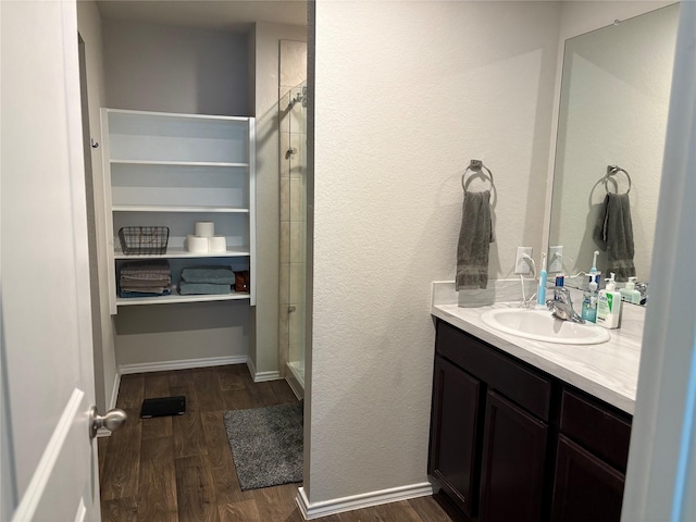 16916 Rich Pines Dr, Conroe, TX 77302 - bathroom with vanity, wood finished floors, and a stall shower