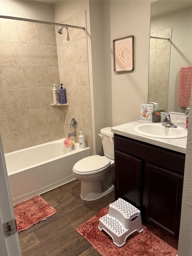 16916 Rich Pines Dr, Conroe, TX 77302 - bathroom with vanity, shower / washtub combination, and wood finished floors