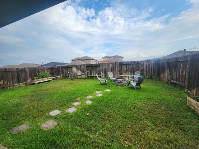 16916 Rich Pines Dr, Conroe, TX 77302 - fenced backyard featuring a fire pit
