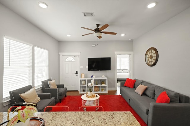 223 Adams St, Houston, TX 77011 - living area with a ceiling fan, recessed lighting, wood finished floors, and baseboards