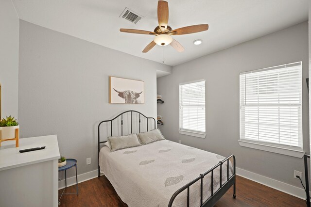 223 Adams St, Houston, TX 77011 - bedroom featuring baseboards, dark wood-style floors, ceiling fan, and recessed lighting