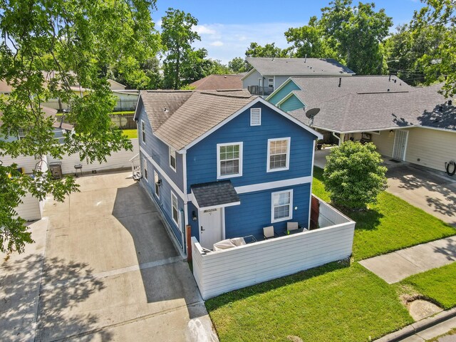 223 Adams St, Houston, TX 77011 - view of front facade with a shingled roof and concrete driveway