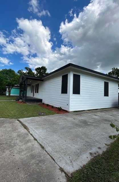 rear view of house with a yard
