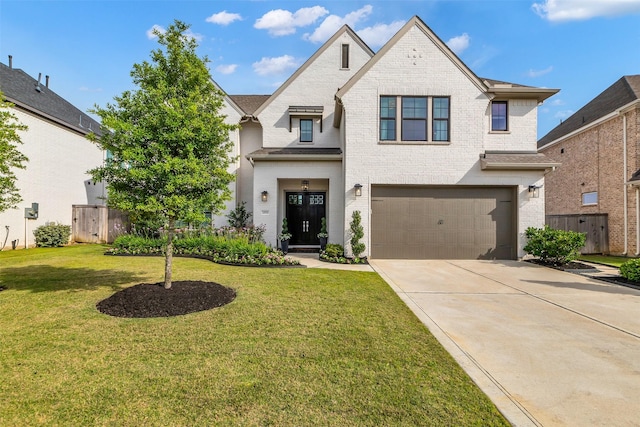 24906 Gingerbush Ln, Tomball, TX 77375 - french country style house with a garage, brick siding, and driveway
