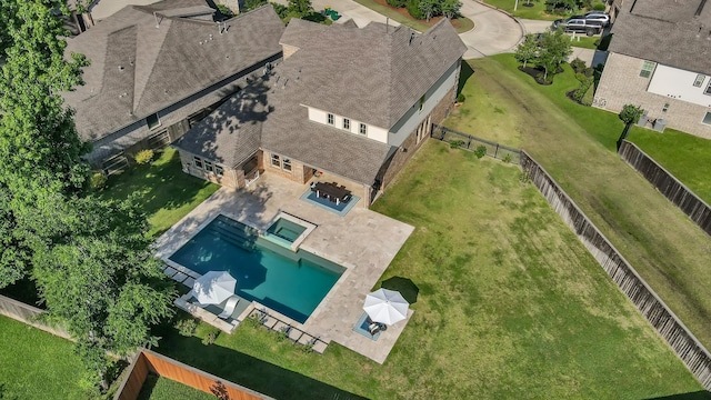 view of subject property with a pool