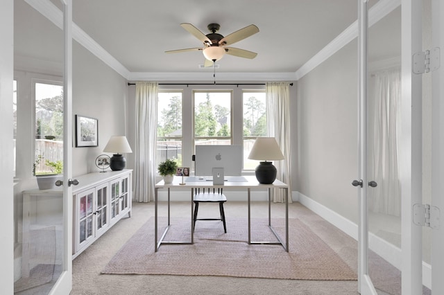 office space featuring french doors, light carpet, crown molding, a ceiling fan, and baseboards