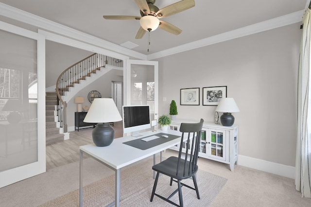 carpeted office featuring ornamental molding, a ceiling fan, and baseboards