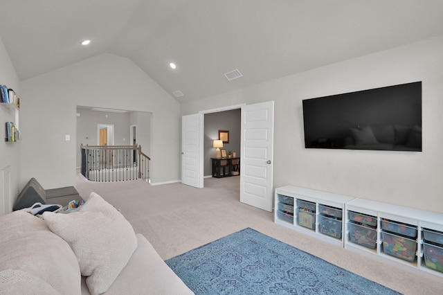 carpeted living room with vaulted ceiling and recessed lighting