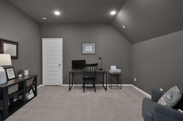 office with light carpet, vaulted ceiling, and baseboards