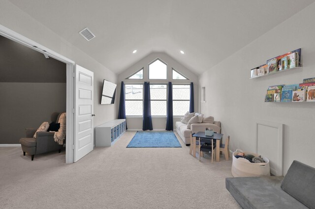living room featuring lofted ceiling, light colored carpet, and recessed lighting