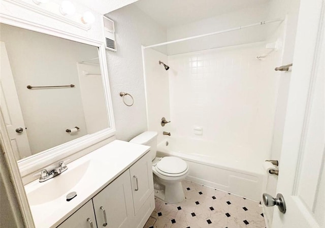 bathroom featuring toilet,  shower combination, and vanity