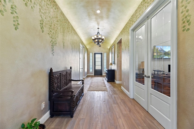 907 Falcon Hollow Ln, Pinehurst, TX 77362 - entryway with a chandelier, hardwood / wood-style floors, french doors, and baseboards