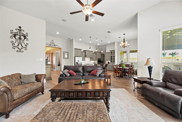 907 Falcon Hollow Ln, Pinehurst, TX 77362 - living room with ceiling fan, a chandelier, light wood finished floors, and recessed lighting