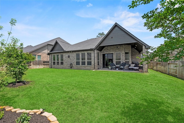 907 Falcon Hollow Ln, Pinehurst, TX 77362 - rear view of property featuring brick siding, a patio, and an outdoor living space