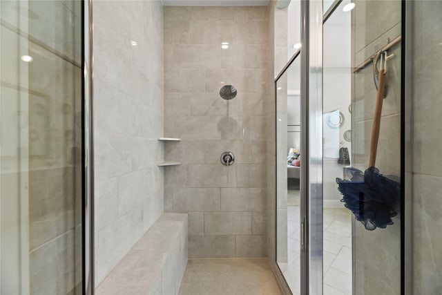 907 Falcon Hollow Ln, Pinehurst, TX 77362 - ensuite bathroom with a shower stall and tile patterned flooring