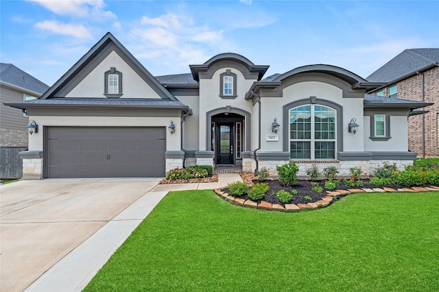 907 Falcon Hollow Ln, Pinehurst, TX 77362 - view of front of property with stucco siding, a front yard, stone siding, and concrete driveway