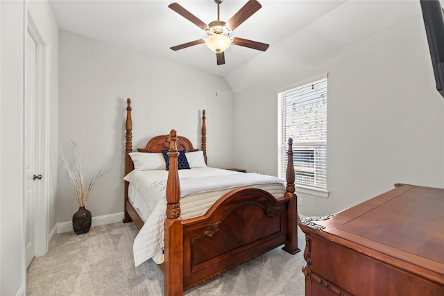 907 Falcon Hollow Ln, Pinehurst, TX 77362 - bedroom featuring light carpet, ceiling fan, baseboards, and vaulted ceiling