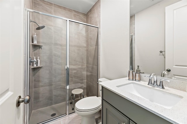 907 Falcon Hollow Ln, Pinehurst, TX 77362 - bathroom with a stall shower, toilet, and vanity