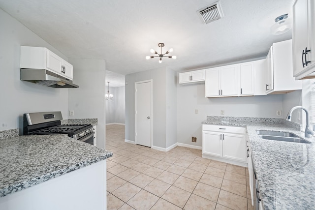 kitchen with a chandelier, stainless steel gas range, a sink, under cabinet range hood, and white cabinetry