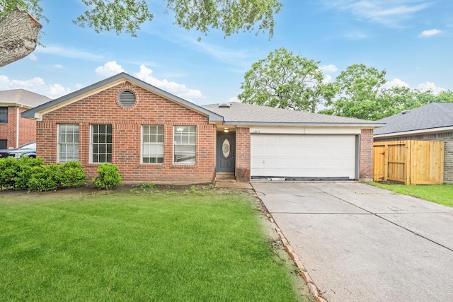single story home with brick siding, concrete driveway, and an attached garage