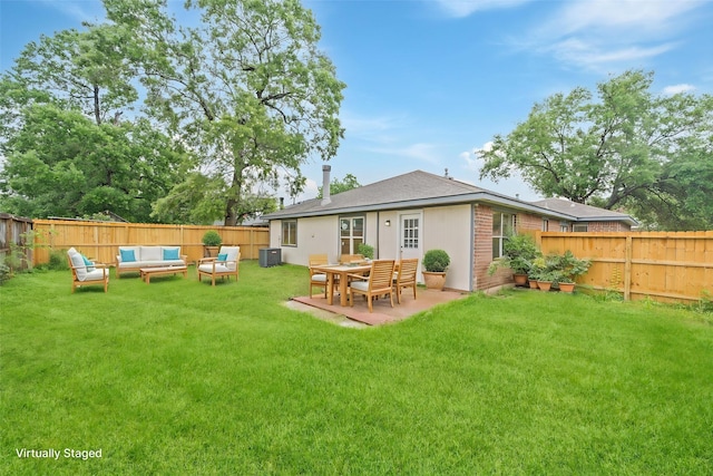 back of property with an outdoor hangout area, central air condition unit, and a patio