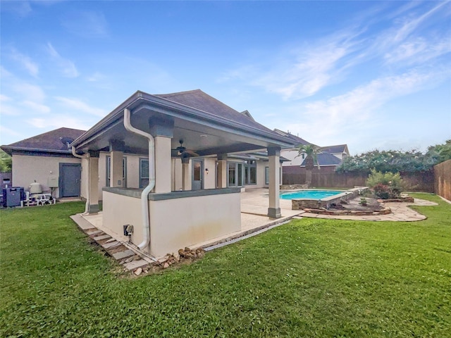 13830 Campwood Ln, Cypress, TX 77429 - view of side of home with ceiling fan, stucco siding, and a patio