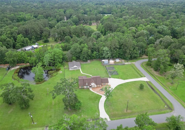 309 County Road 3665 E, Splendora, TX 77372 - bird's eye view of a heavily wooded area and a large body of water
