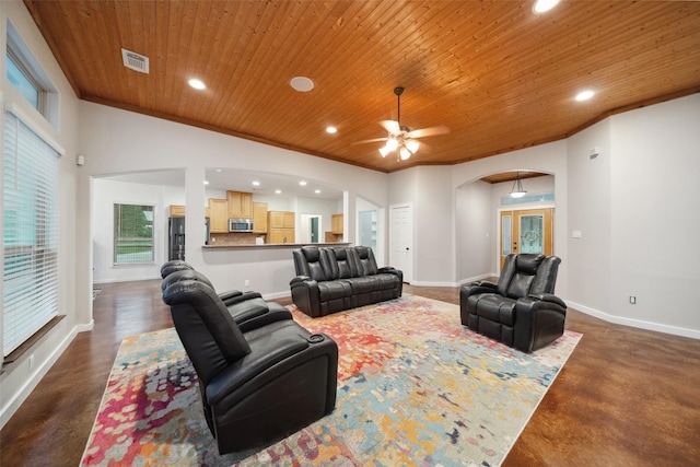 309 County Road 3665 E, Splendora, TX 77372 - living room featuring arched walkways, wooden ceiling, recessed lighting, ceiling fan, and finished concrete flooring
