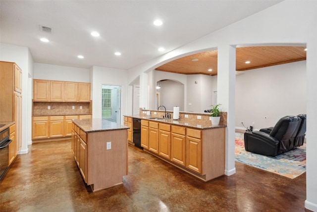 309 County Road 3665 E, Splendora, TX 77372 - kitchen with finished concrete floors, a kitchen island, black appliances, and recessed lighting